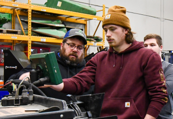 Joe Airheart shows a student how to use planter technology