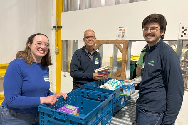 Keystone employee's packing food at a food bank.
