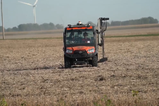 Kubota in a field taking soil samples