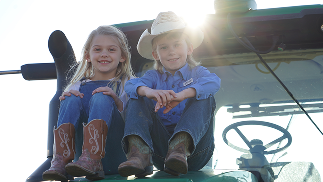 Kids sitting on equipment