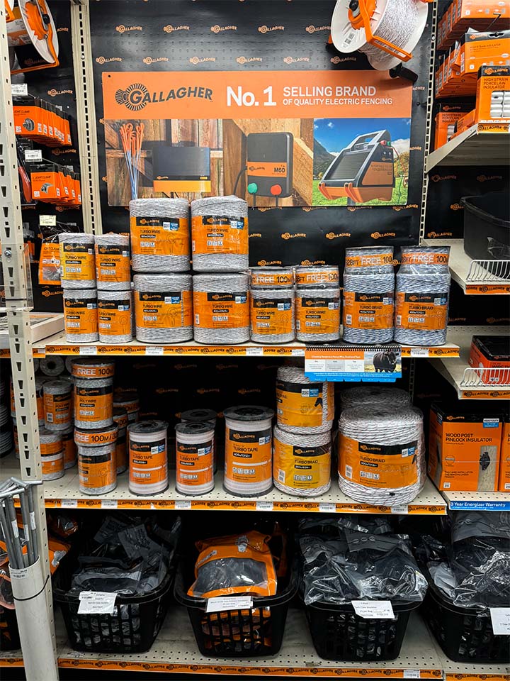 A shelf display of Gallagher fencing products.