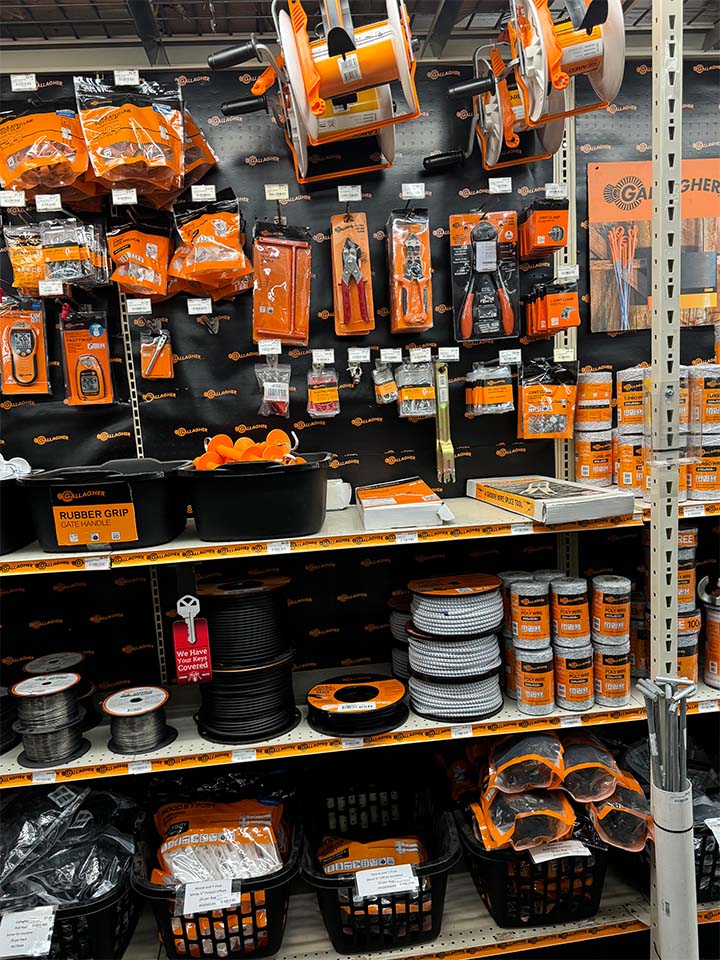 A shelf display of Gallagher fencing products.