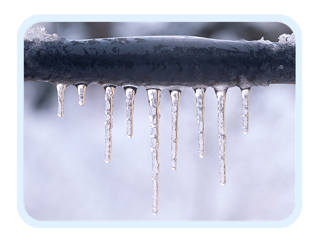 Frozen pipe covered in ice cicles.