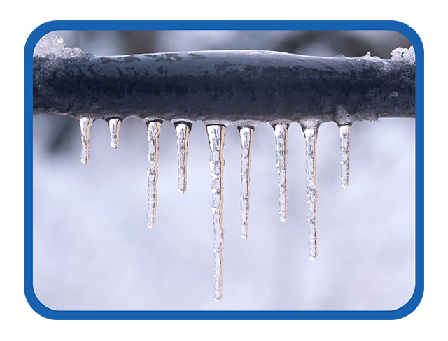 Frozen pipe covered in ice cicles.