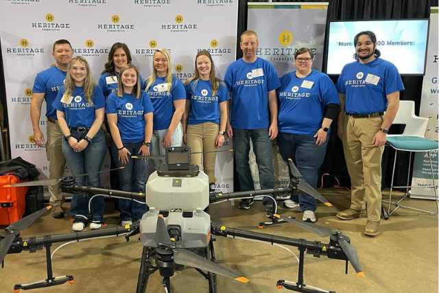 Heritage Cooperative employees posing with drone at Ohio FFA State Convention