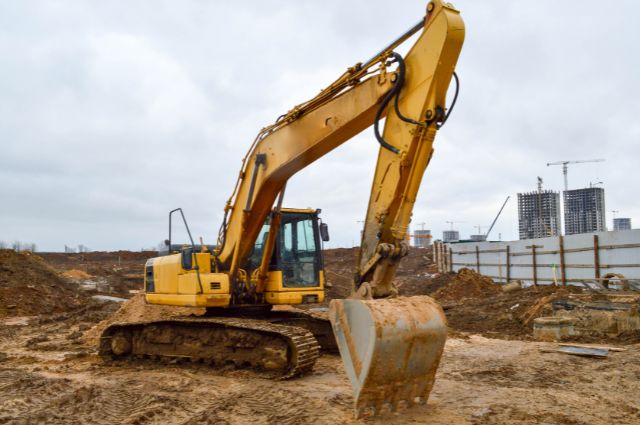 Large Excavator Working on Dirt at Commercial Construction Site