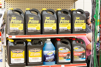 Auto section shelf lined with products.