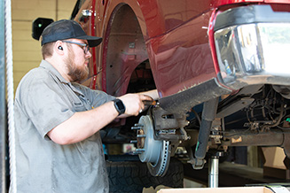 Mechanic working on a vehicle.