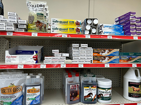 Shelves filled with various horse health products.