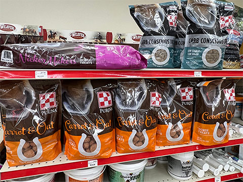 Shelves of horse feed from Purina.