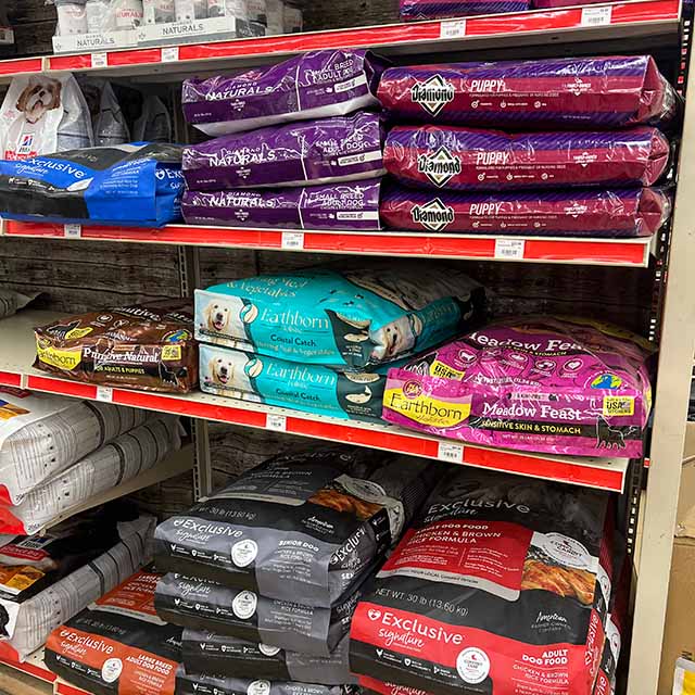 Shelves of pet food bags.