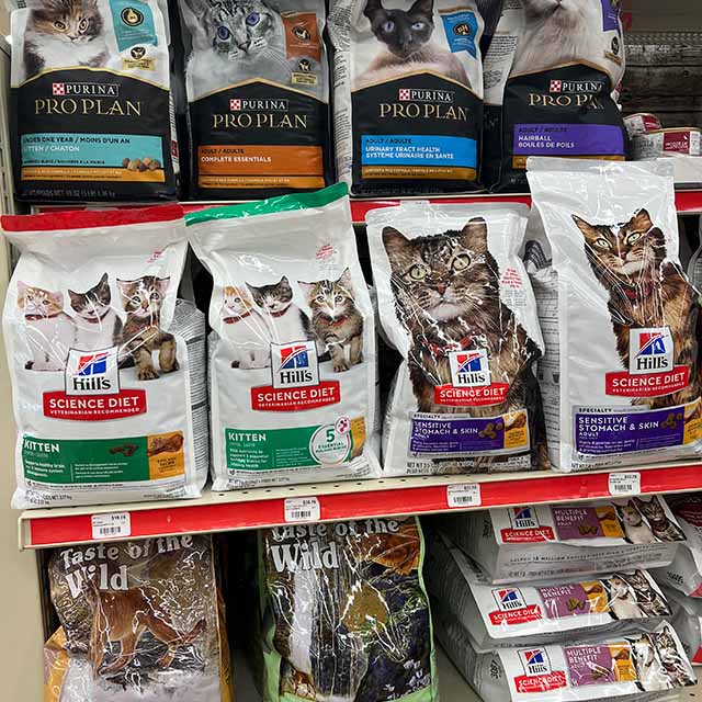 Shelves of cat food bags.