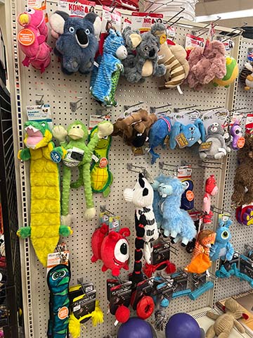 Wall display of pet toys.