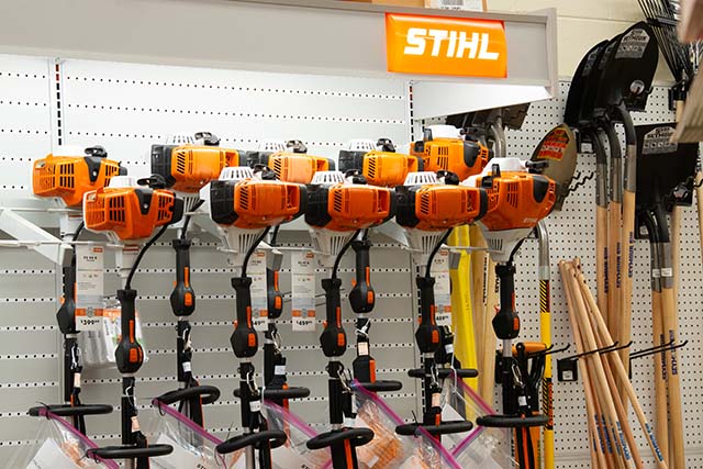 A photo of a wall covered in Stihl smaller power equipment.