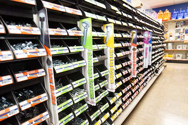 An isle lined with bins of various screws, nuts, washers, etc.