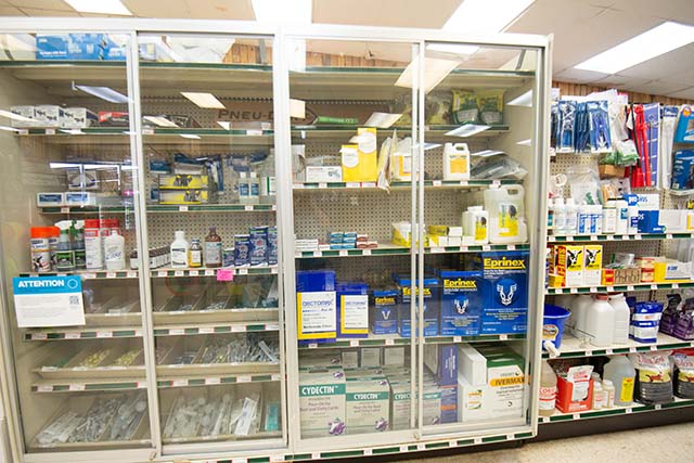 Shelves filled with animal health supplies.
