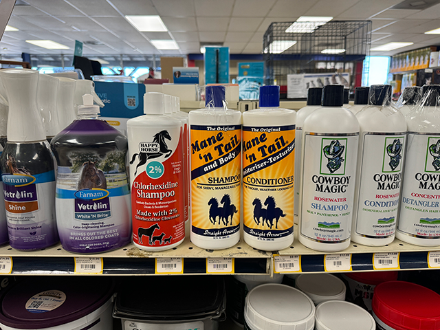 Equine shampoo and conditioner lined shelves