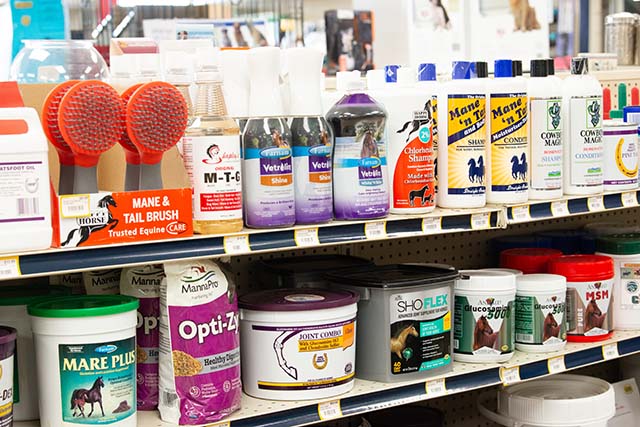 Shelves filled with equine health and care supplies.