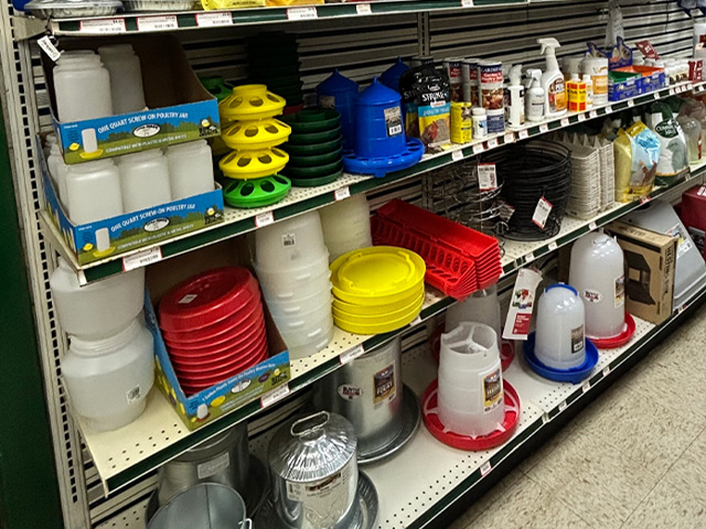 An overview of poultry products and feeders lining the shelves of the Co-op