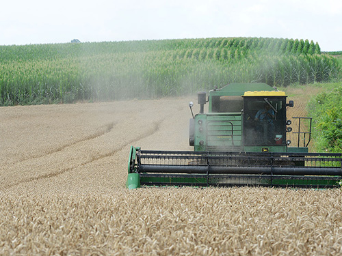 A tractor drive through a field.