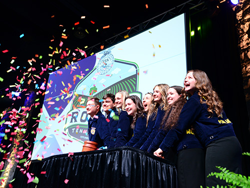 FFA members celebrating with confetti flying in the air.