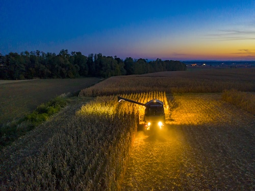 A tractor driving through a field.