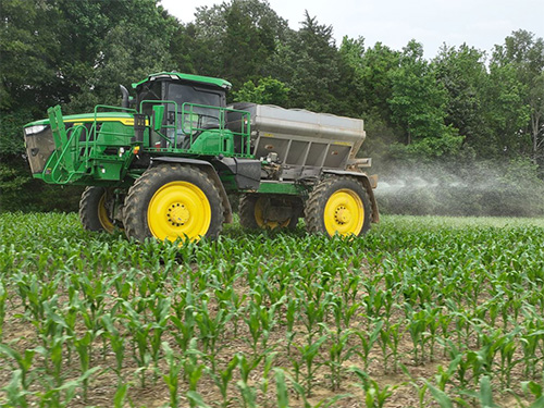 Spraying crops with chemicals