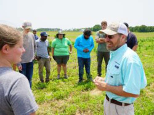 Students listening to a speaker about agronomy.