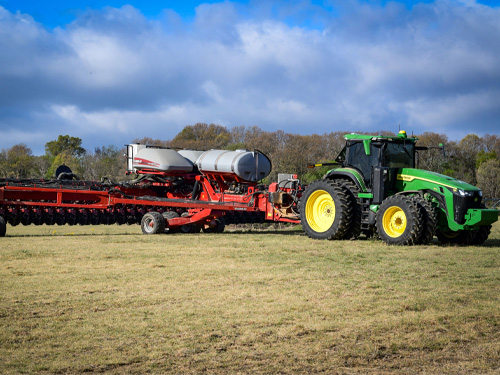 A tractor in the field on Drew Bailey's farm