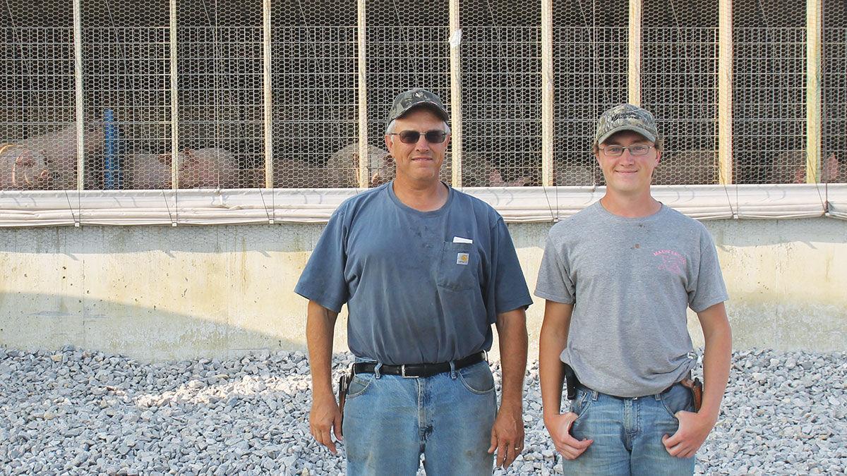 Charles Leitz and his son Ben pig barn